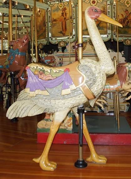 A carousel with a large ostrich
Description automatically generated
