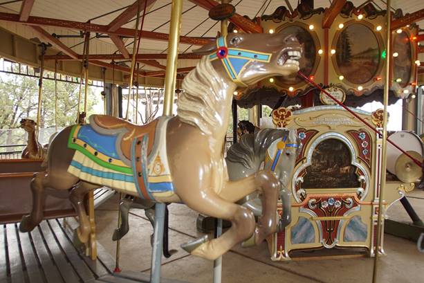 A picture containing carousel, outdoor object, ride, floor

Description automatically generated
