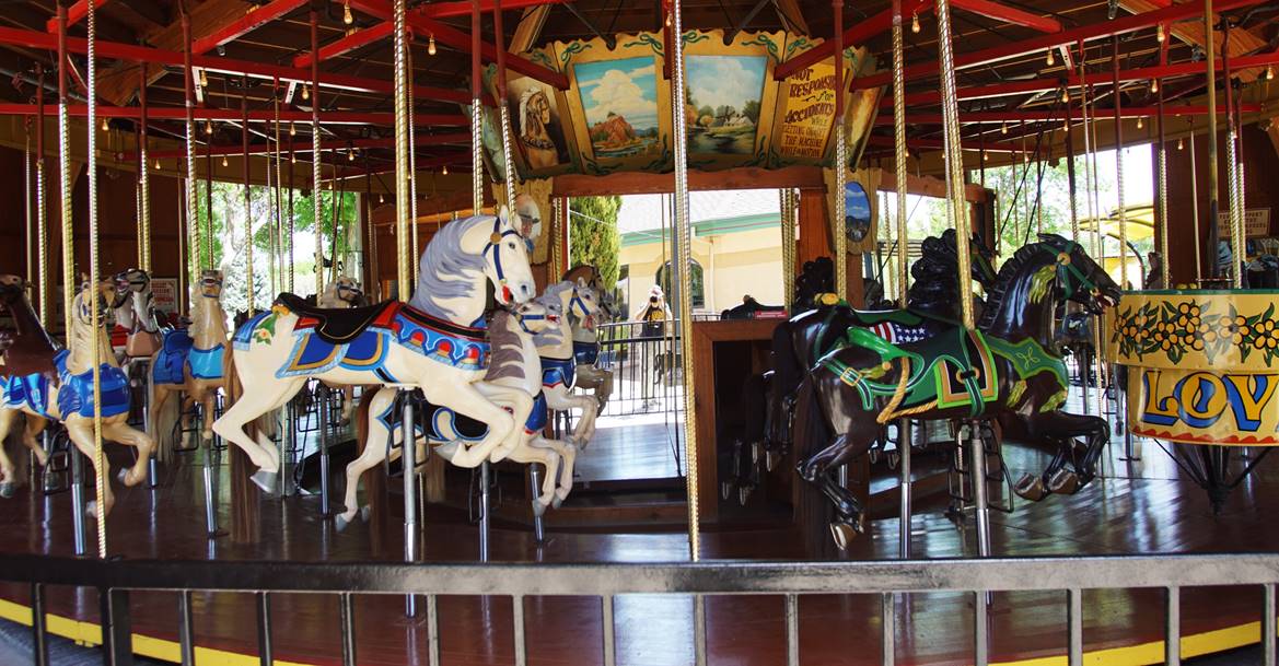 A picture containing carousel, outdoor object, ride
Description automatically generated