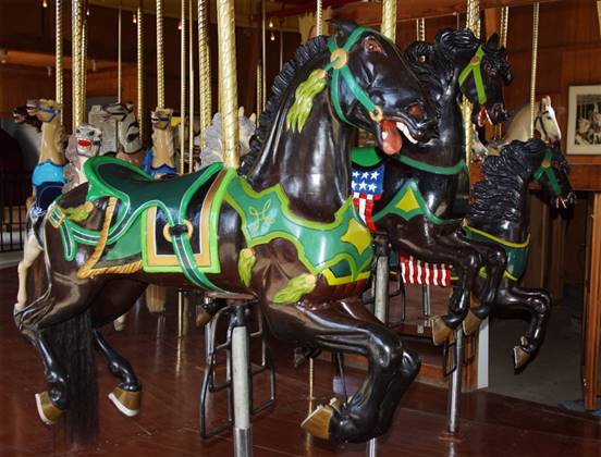 A picture containing carousel, floor, ride, indoor
Description automatically generated