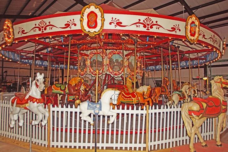 A picture containing outdoor object, ride, carousel

Description automatically generated