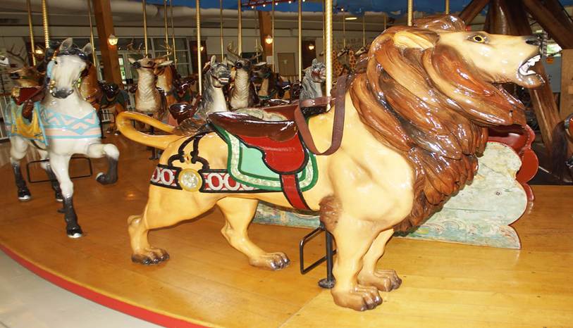 A picture containing carousel, ride, outdoor object, indoor
Description automatically generated