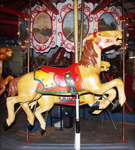 A picture containing text, floor, indoor, carousel

Description automatically generated