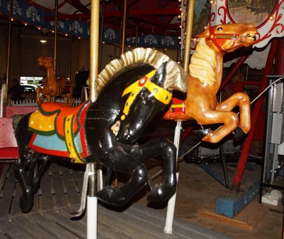 A picture containing floor, indoor, ride, carousel

Description automatically generated