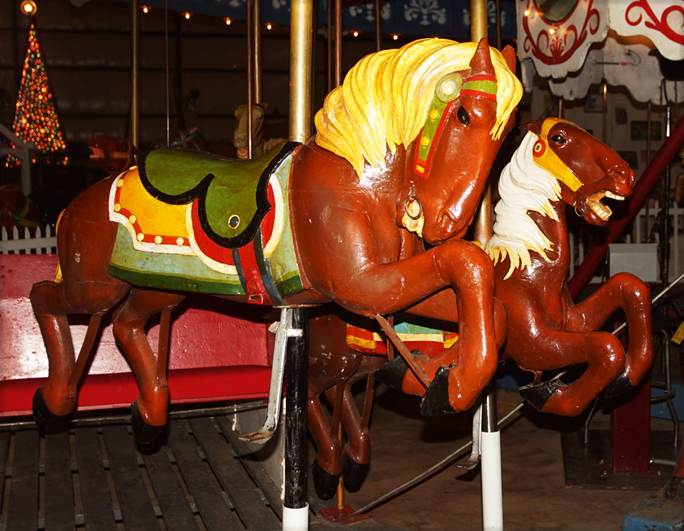 A picture containing floor, indoor, ride, carousel

Description automatically generated