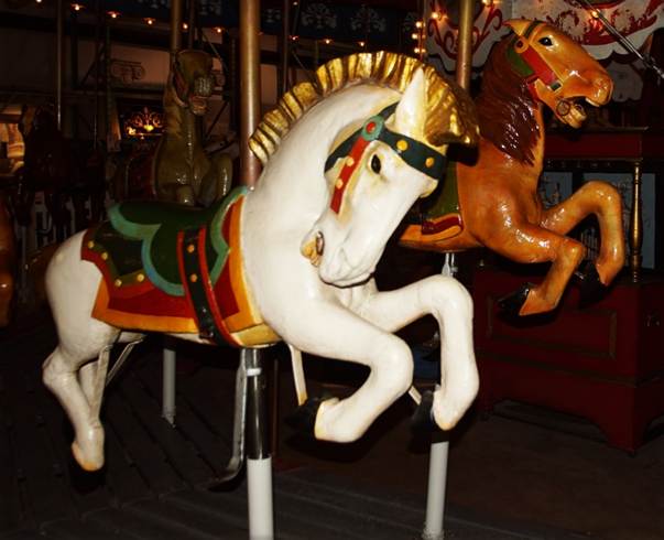 A picture containing carousel, ride, outdoor object, indoor

Description automatically generated