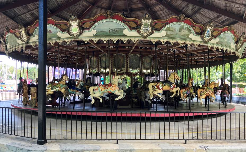 A carousel with horses on it
AI-generated content may be incorrect.