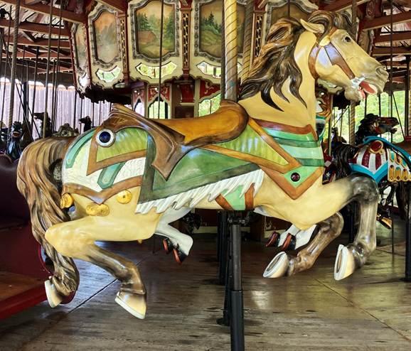A carousel with horses on it
AI-generated content may be incorrect.