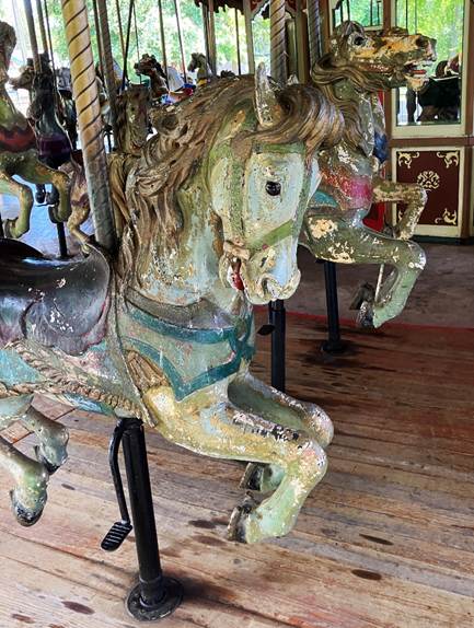 A carousel horse with a horse head

AI-generated content may be incorrect.