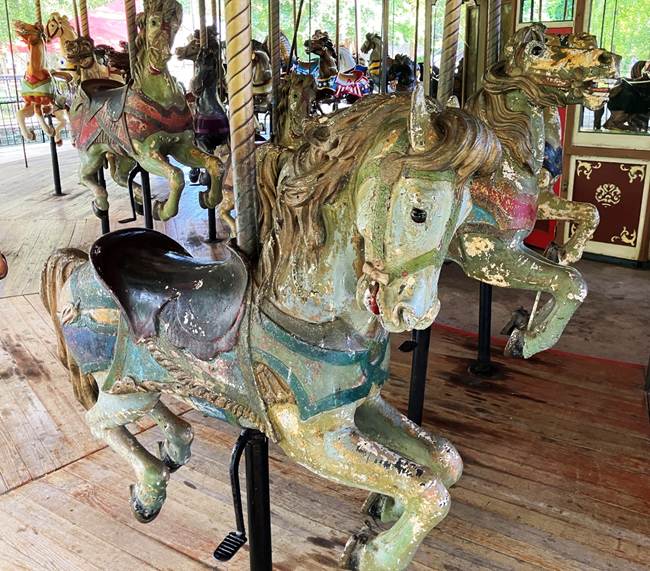 A group of horses on a merry go round
AI-generated content may be incorrect.