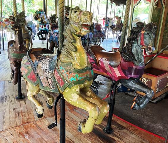 A group of horses on a merry go round
AI-generated content may be incorrect.