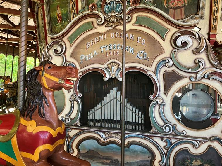 A horse statue next to an organ
AI-generated content may be incorrect.