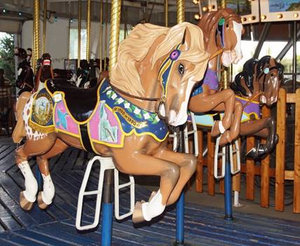 A picture containing carousel, outdoor object, ride

Description automatically generated