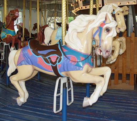 A picture containing carousel, ride, outdoor object, indoor

Description automatically generated
