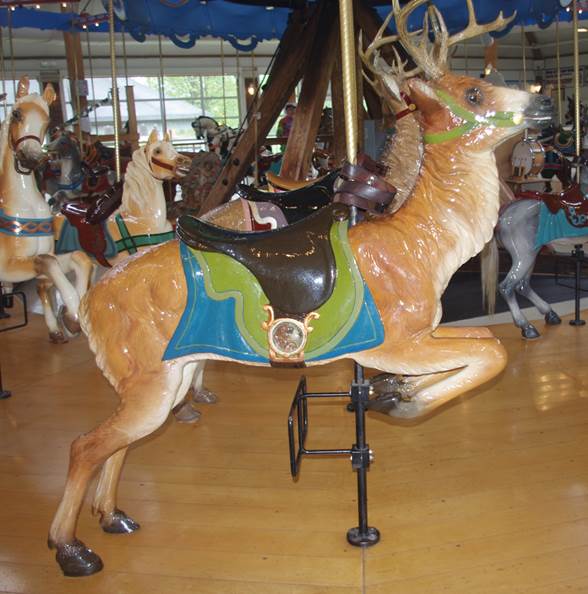 A merry go round with a deer
Description automatically generated