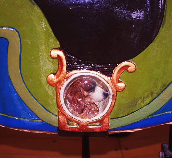 A dog in a window
Description automatically generated