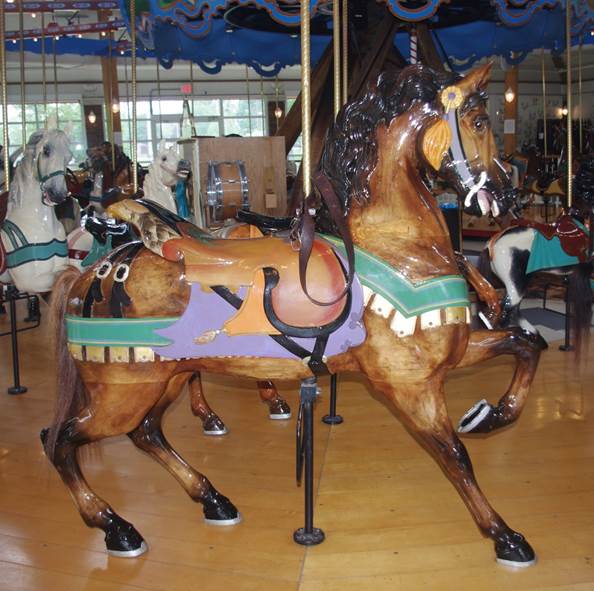 A carousel horse with saddles
Description automatically generated