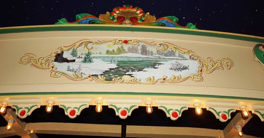 A sign with a painting on it
Description automatically generated