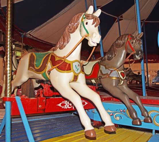 A statue of a person riding a horse

Description automatically generated