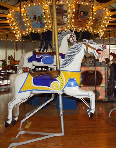 A picture containing carousel, floor, ride, indoor

Description automatically generated