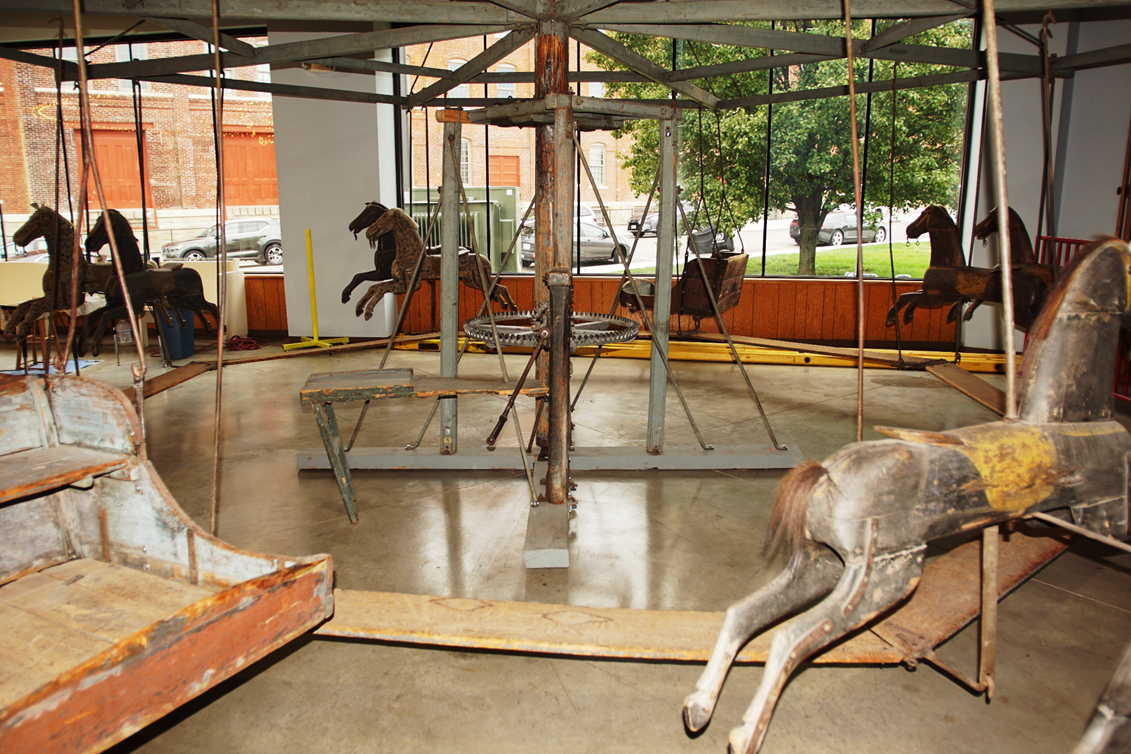 A picture containing indoor, floor, building, table
Description automatically generated