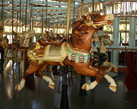 A carousel horse with horses on it
Description automatically generated with medium confidence
