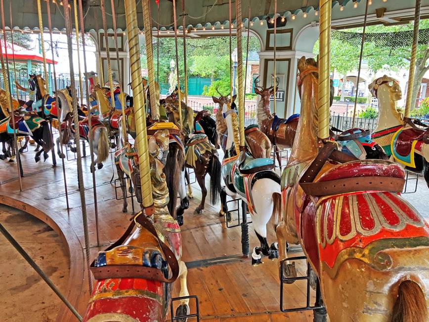 A group of horses on a merry go round
AI-generated content may be incorrect.