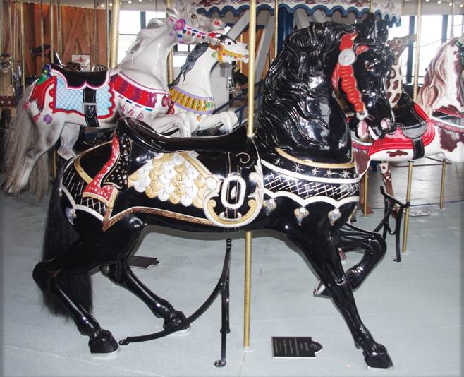A black and white carousel horse
Description automatically generated