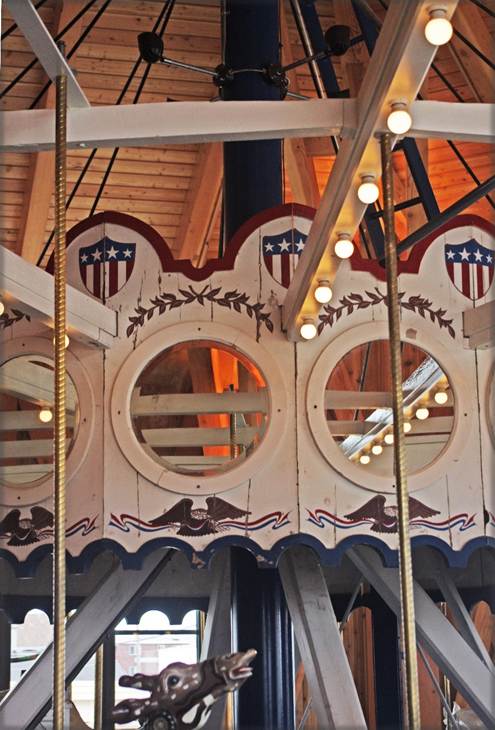 A carousel with round windows

Description automatically generated