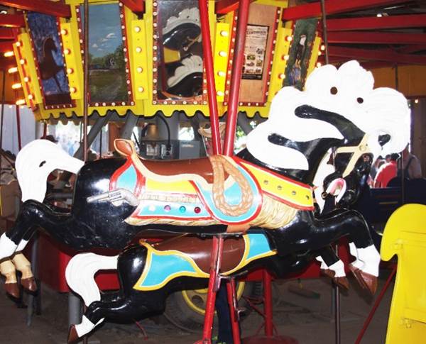 A picture containing indoor, floor, ride, sitting
Description generated with very high confidence