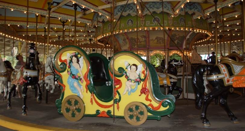 A close up of a carousel

Description generated with very high confidence