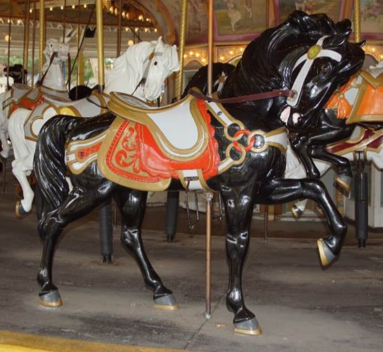 A picture containing carousel, outdoor object, floor, ride
Description generated with very high confidence