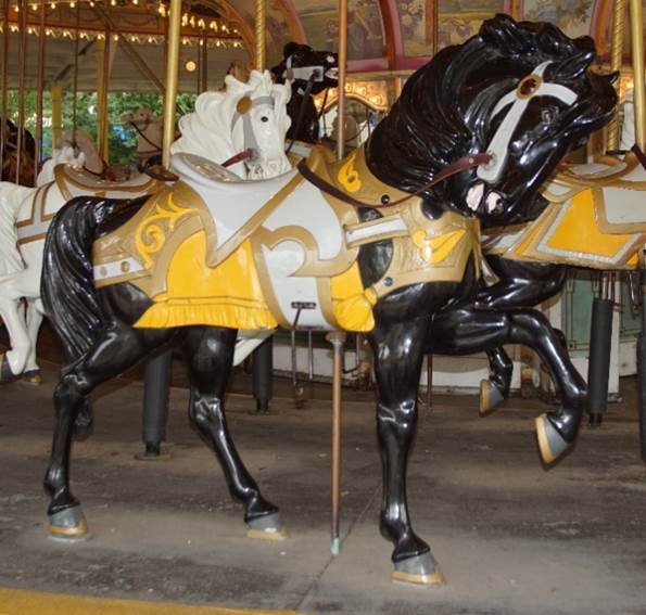 A picture containing floor, indoor, yellow, carousel

Description generated with high confidence