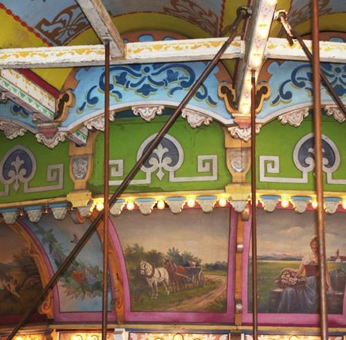 A sign on the side of a carousel
Description generated with high confidence