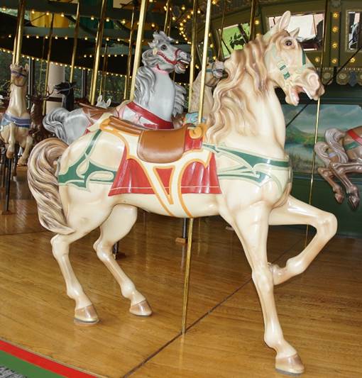 A picture containing carousel, floor, outdoor object, indoor

Description automatically generated