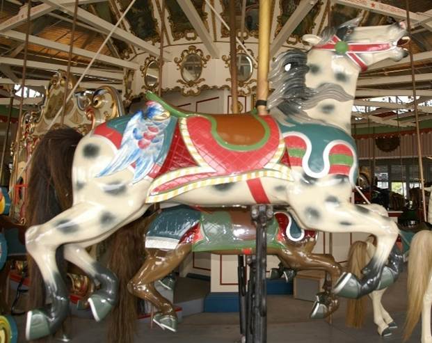 A carousel horse with wings and a horse on it
Description automatically generated with medium confidence