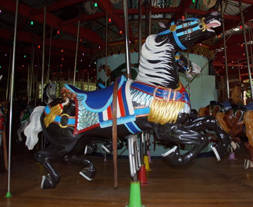 A horse on a merry go round
Description automatically generated