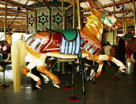 A horse on a merry go round
Description automatically generated