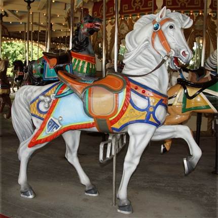 A close up of a horse drawn carriage

Description automatically generated