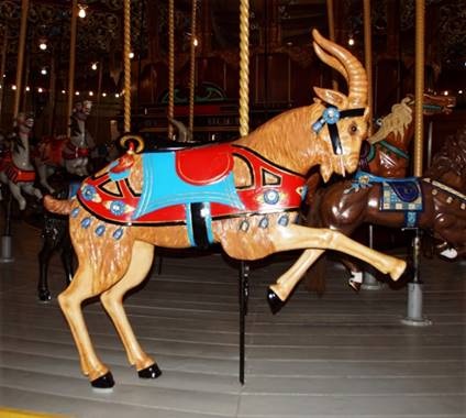 A goat on a merry go round

Description automatically generated with medium confidence