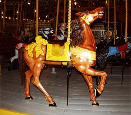 A picture containing carousel, ride, horse, amusement ride

Description automatically generated