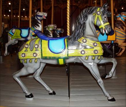 A picture containing carousel, ride, amusement ride, horse

Description automatically generated