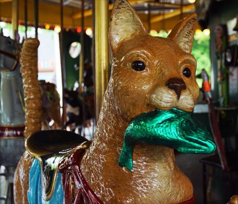 A picture containing carousel, horse, animal figure, amusement park

Description automatically generated