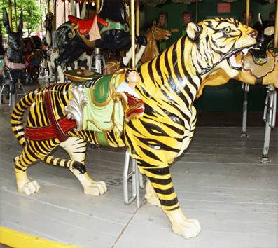 A picture containing carousel, mammal, tiger, ride
Description automatically generated