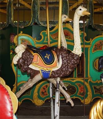 A picture containing carousel, ride, horse, amusement ride

Description automatically generated