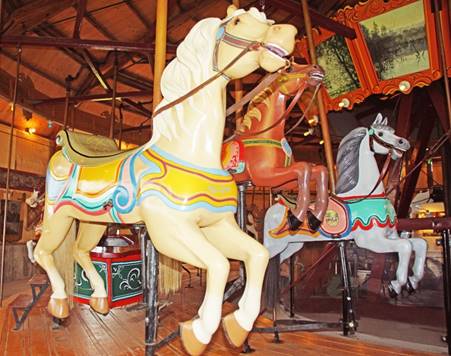 A group of horses on a merry go round

Description automatically generated with medium confidence