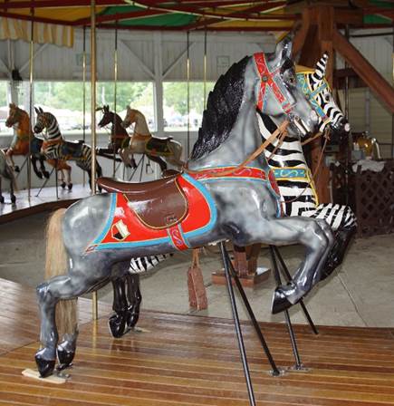A carousel horse with a zebra on it
Description automatically generated with medium confidence