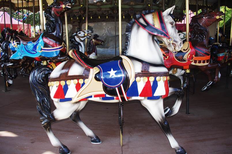 A horse on a merry go round
Description automatically generated