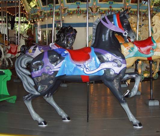 A horse on a merry go round
Description automatically generated