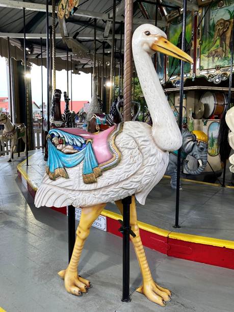 A carousel with a white bird
AI-generated content may be incorrect.